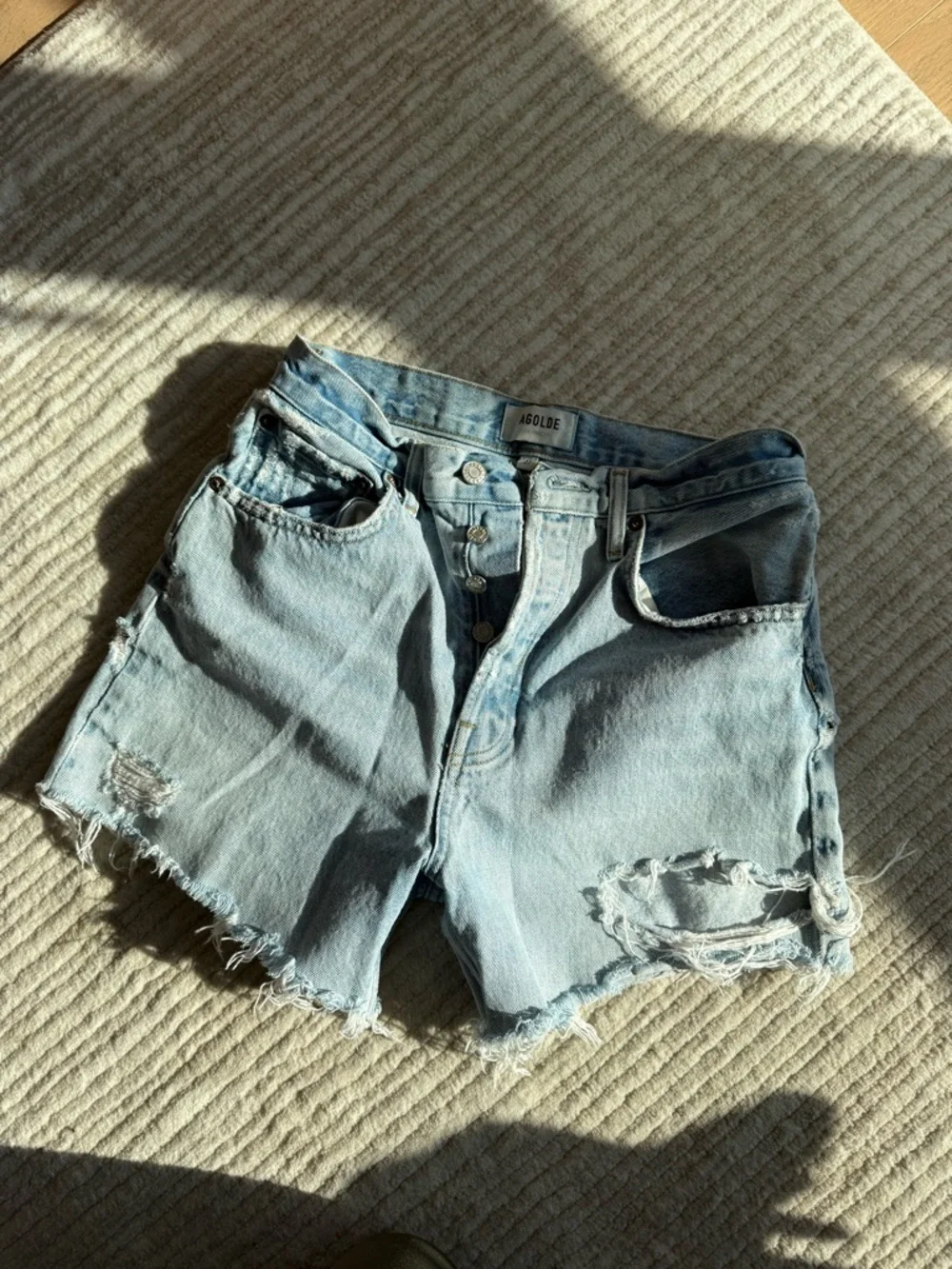 Agolde Riley Distressed High-Rise Light Blue Denim Shorts - Picture 3 of 5